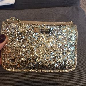 Gold Kate Spade card holder with clip chain